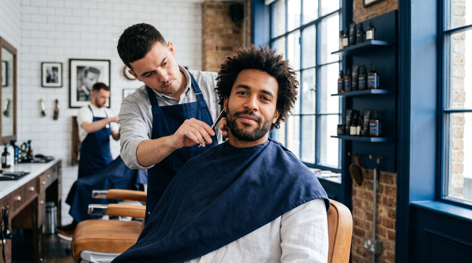 Man with thinning hair styling short haircut with product
